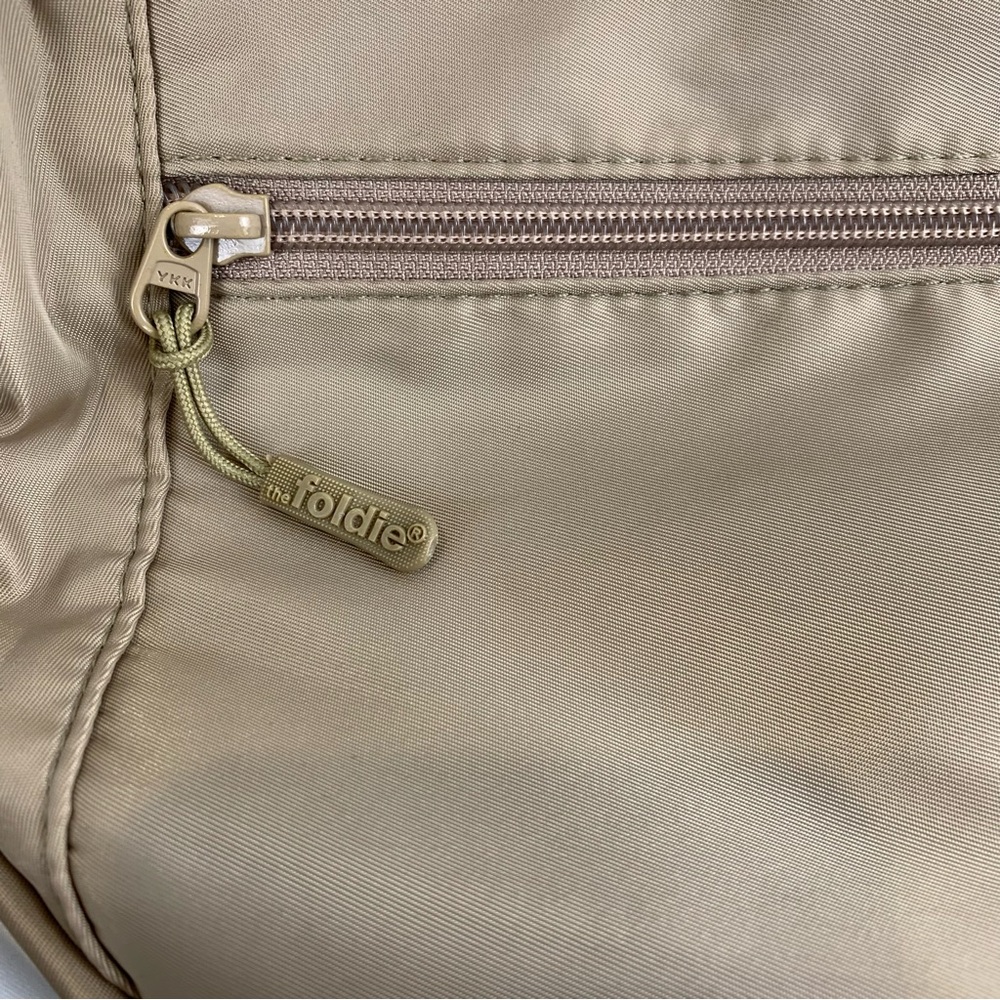 NWOT The Foldie Crossbody Travel Bag Taupe Beige RFID Safe Cut-Proof Strap - Picture 10 of 11